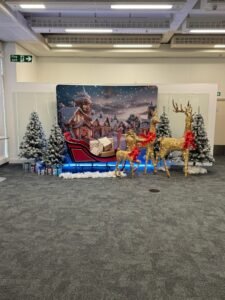 Christmas party décor with balloon styling and personalised backdrop by Events Right Northampton