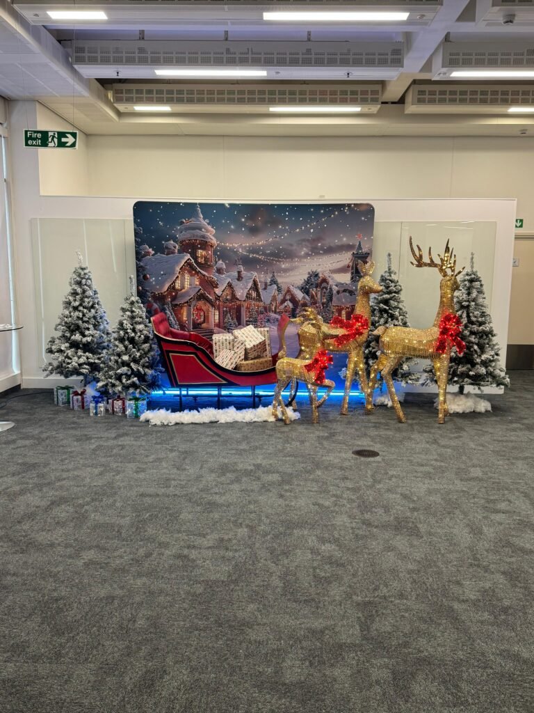 Christmas party décor with balloon styling and personalised backdrop by Events Right Northampton